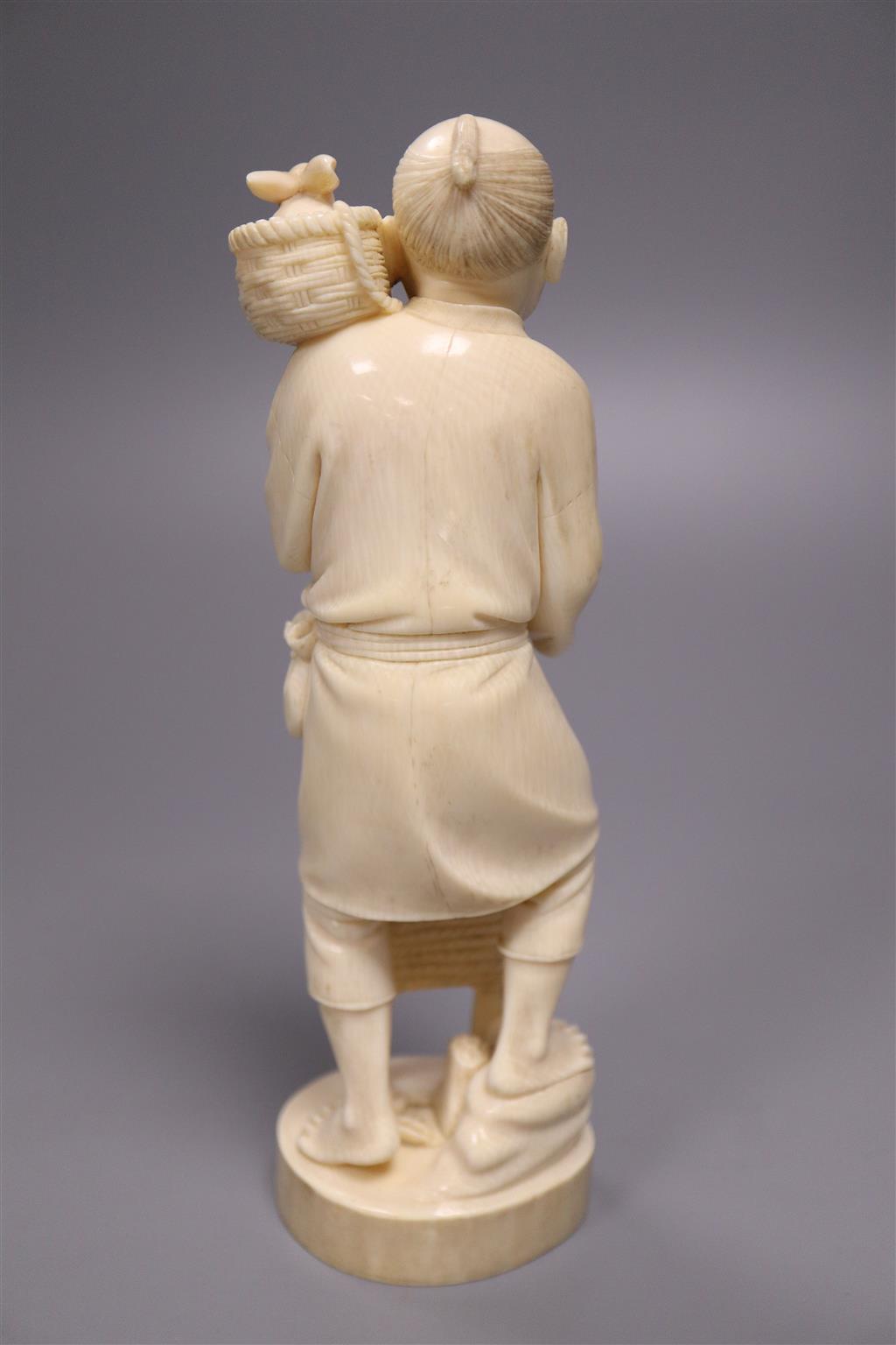 A Japanese Tokyo school ivory group of a farmer and a rabbit, Meiji period.